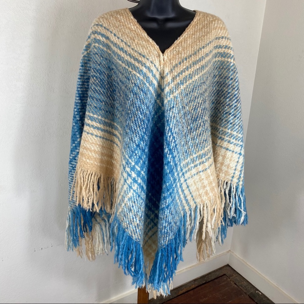 tan, cream, and blue wool poncho. - 623